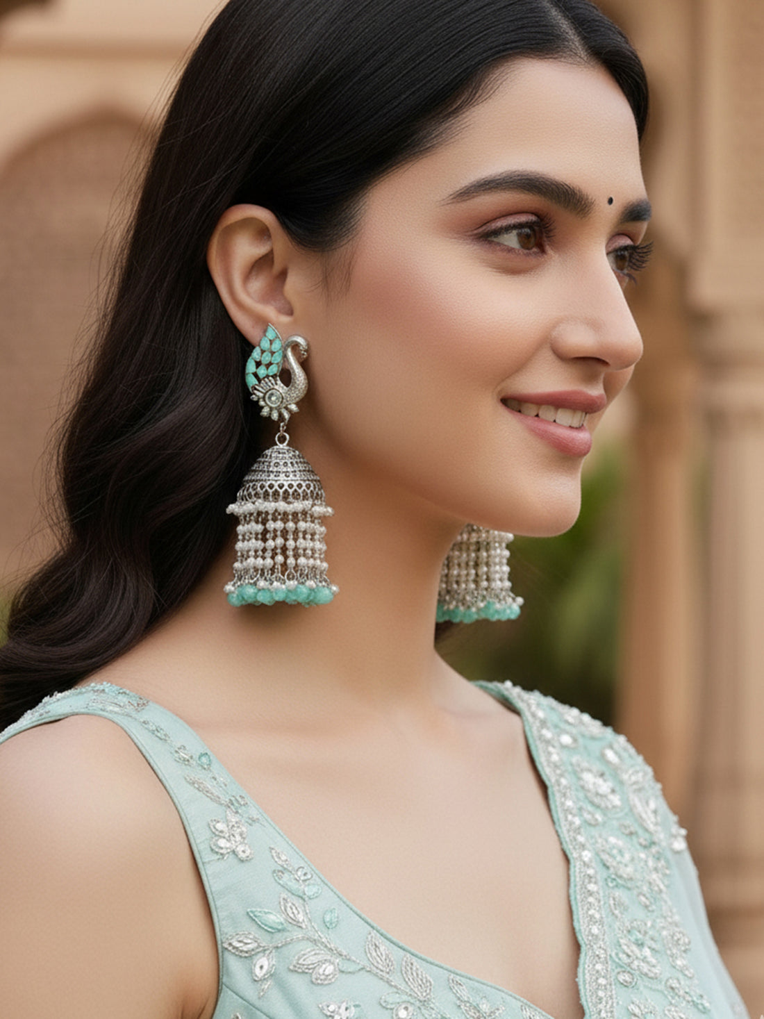 Karatcart Oxidised Silver Light Blue Kundan Peacock Jhumki Earrings for Women