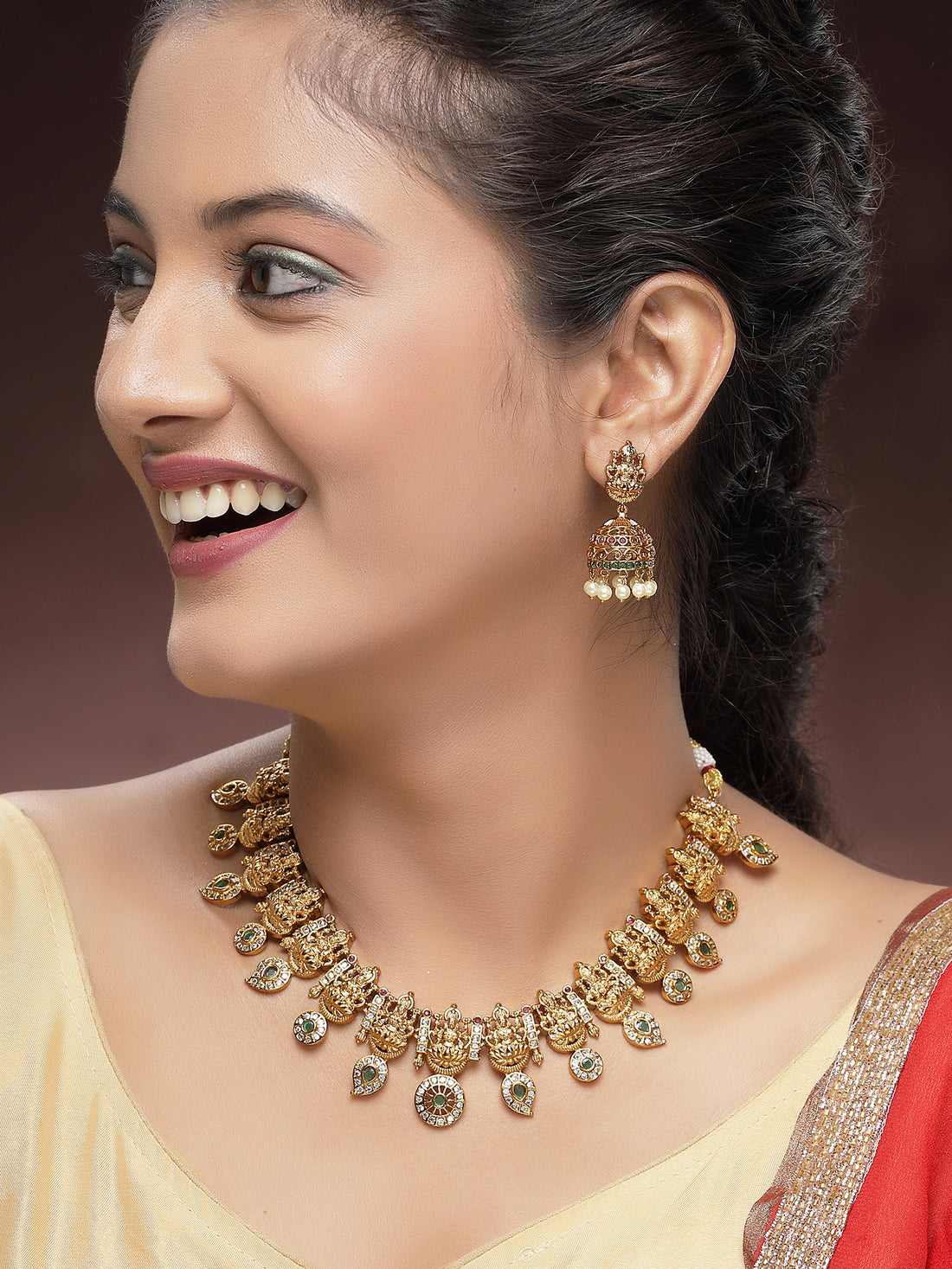 KARATCART Traditional Gold-Plated Green Stones Laxmi Mata Temple Jewellery Set for Women