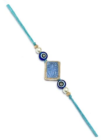 Karatcart Set of 2 Blue Carved Stone Evil Eye Kundan Rakhi for Brother with Roli & Chawal