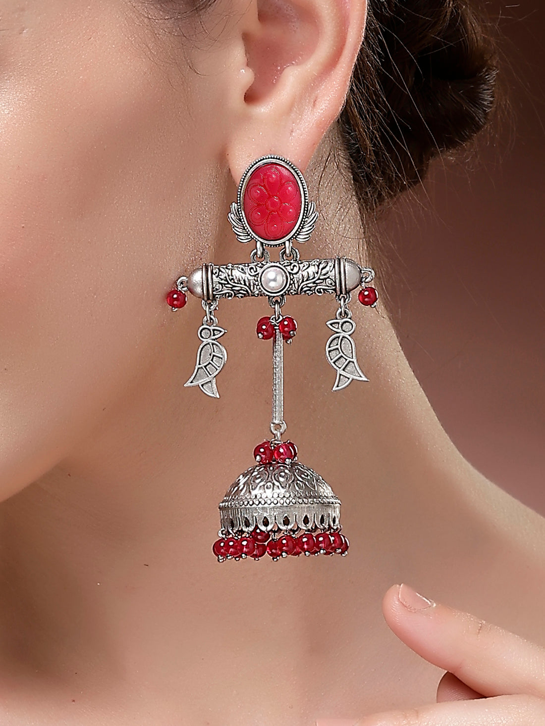 Karatcart Traditional Oxidized Silver Red Carved Stone Jhumka Earrings with Bird Motifs