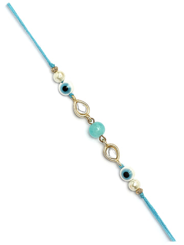 Karatcart Gold Plated Light Blue Bead Evil Eye Kundan Bhiya Rakhi with Roli & Chawal