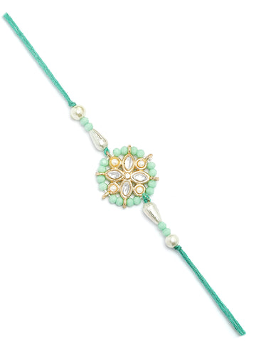Karatcart Gold Plated Light Blue Crystal Floral Kundan Bhiya Rakhi with Roli & Chawal