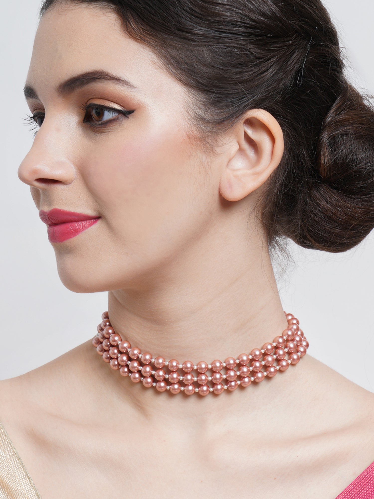 A classic petite pearl on sale choker with rose gold crystals at center echoed by rose gold color spacer beads and rose gold toggle clasp