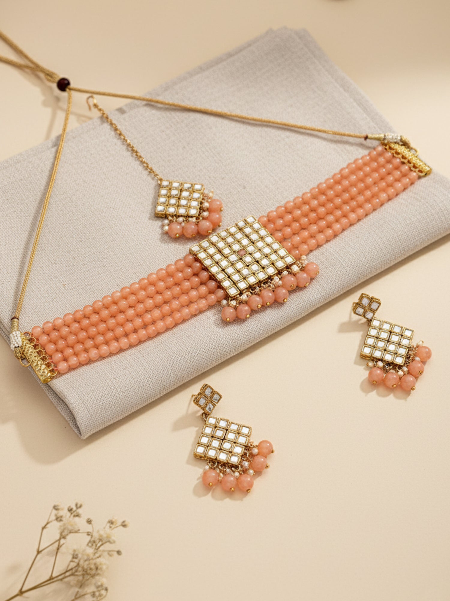 Gold-Plated Embellished Kundan and Peach Beads Handcrafted Choker Necklace Set