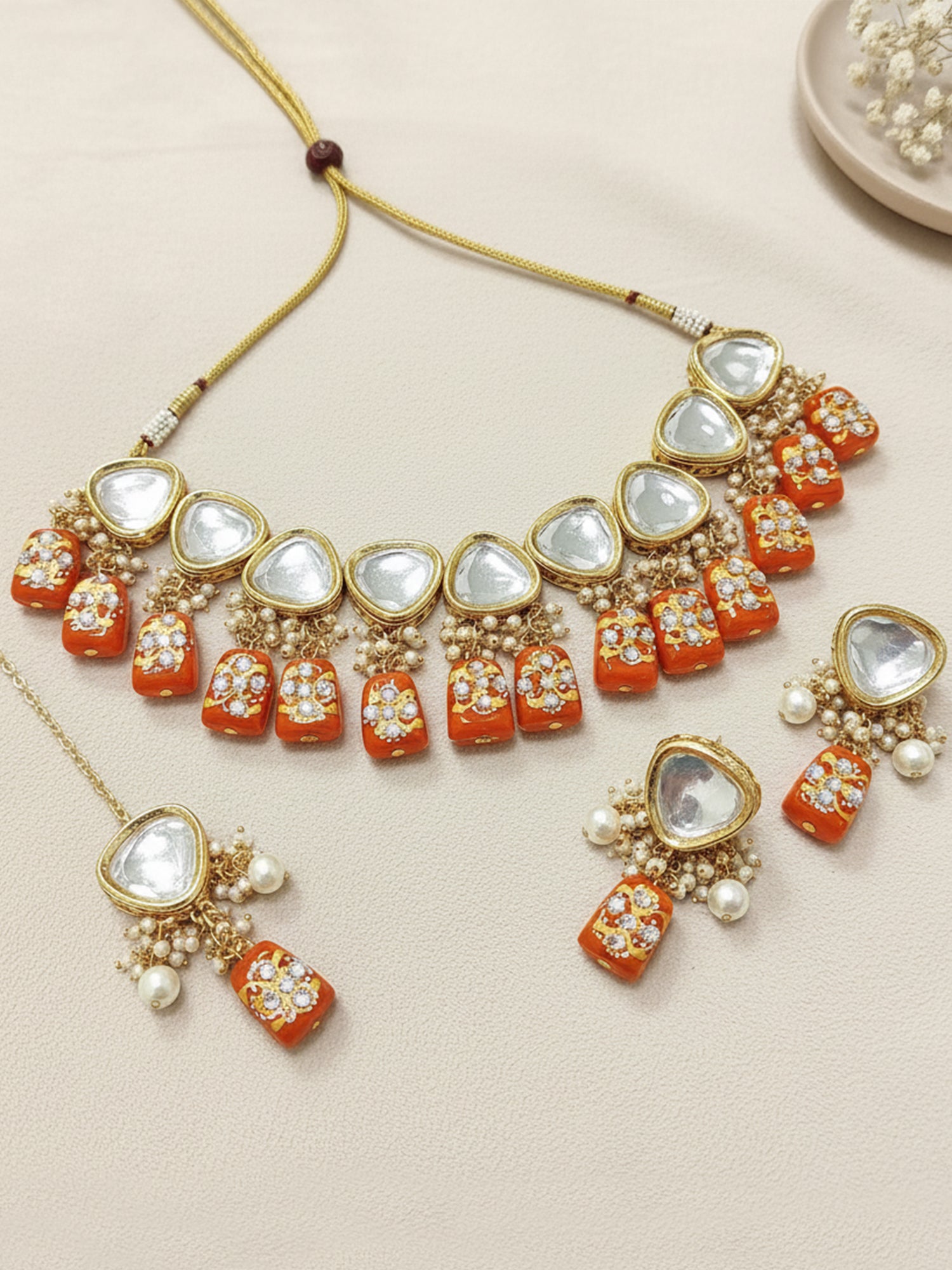 Gold-Plated Orange & White Polki Kundan-Studded & Pearl Beaded Handcrafted Jewellery Set