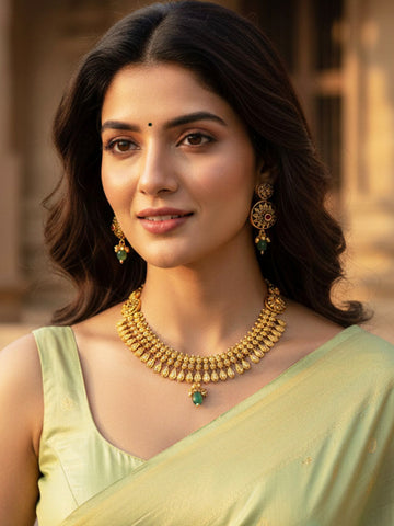 KARATCART Traditional Gold-Plated Floral Engraved Necklace Set with Green Stones for Women
