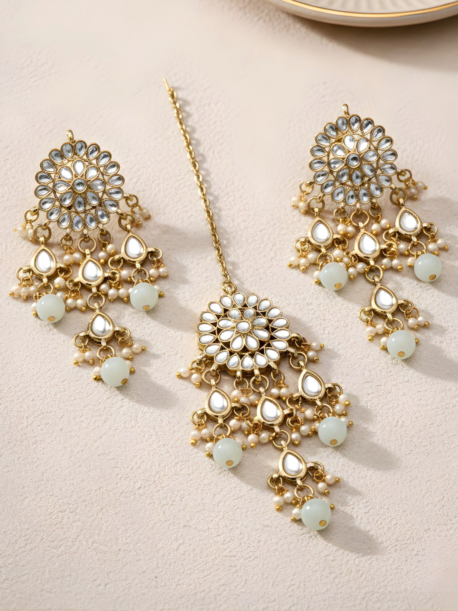 Gold Plated Embellished Light Green Kundan Tassel Earrings with Maangtikka