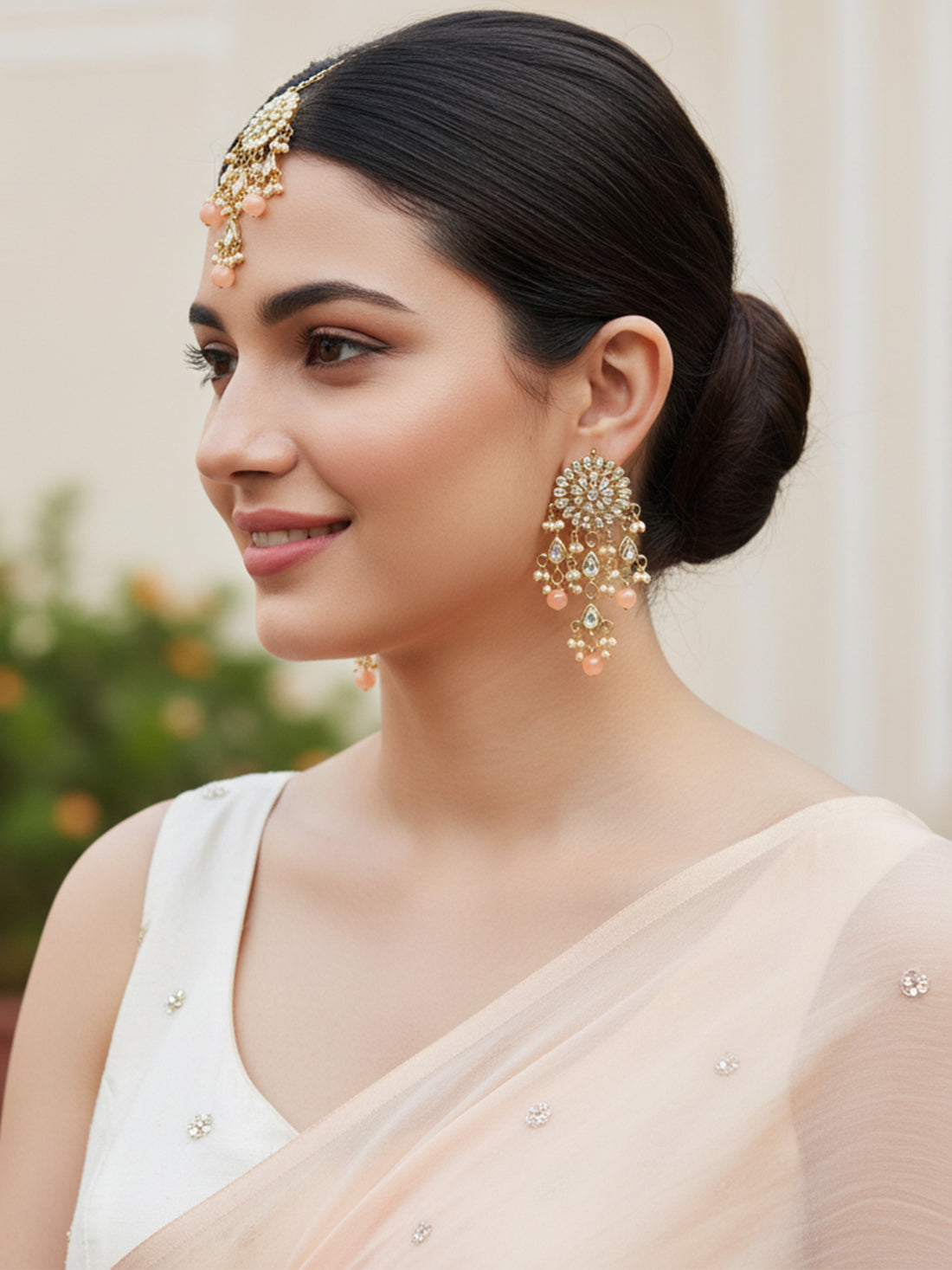 Gold Plated Embellished Peach Kundan Tassel Earrings with Maangtikka