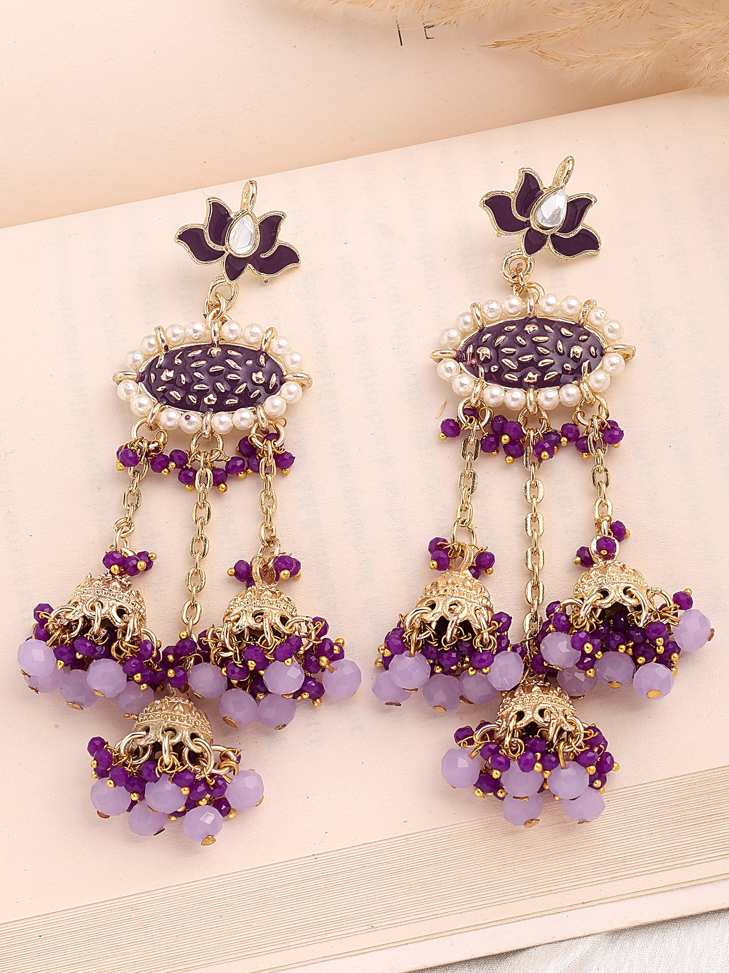 KARATCART Gold-Plated Purple Enamel Crystal-Studded Kundan Tassel Earrings for Women - Image 1