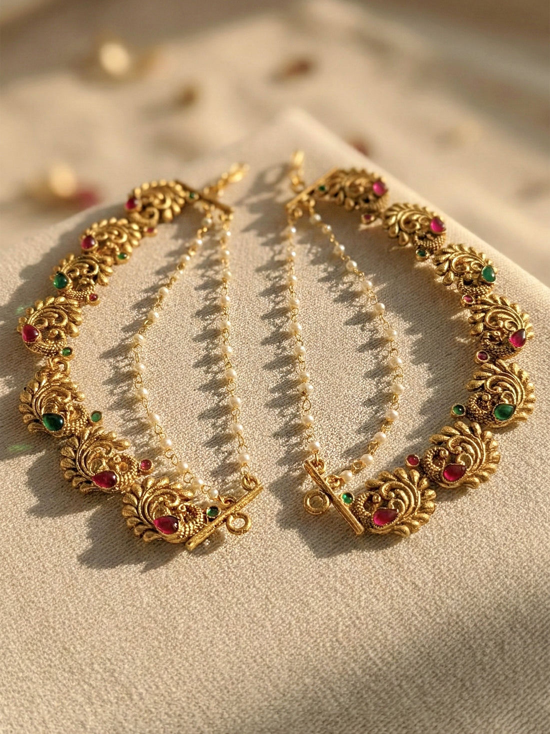 KARATCART Designer Gold-Plated Red and Green Stone Studded Peacock Kaanchain Earrings for Women