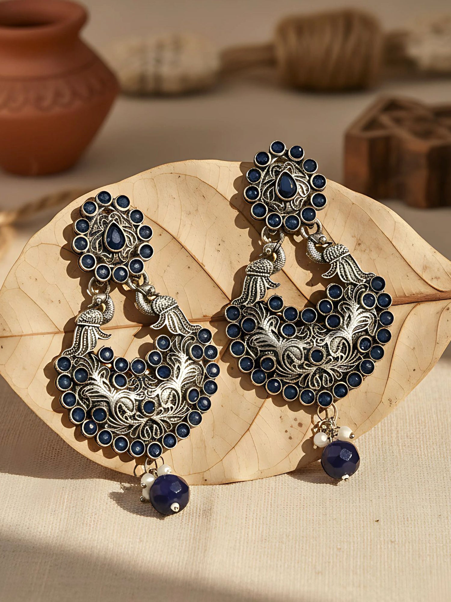 Karatcart Oxidised Silver Drop Shape Peacock Blue Stone Dangler Earring for Women