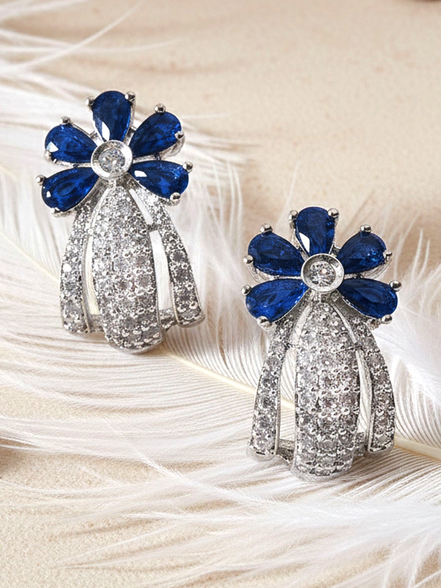 Karatcart Silver Plated Blue Stones Floral Design AD Stud Earrings for Women