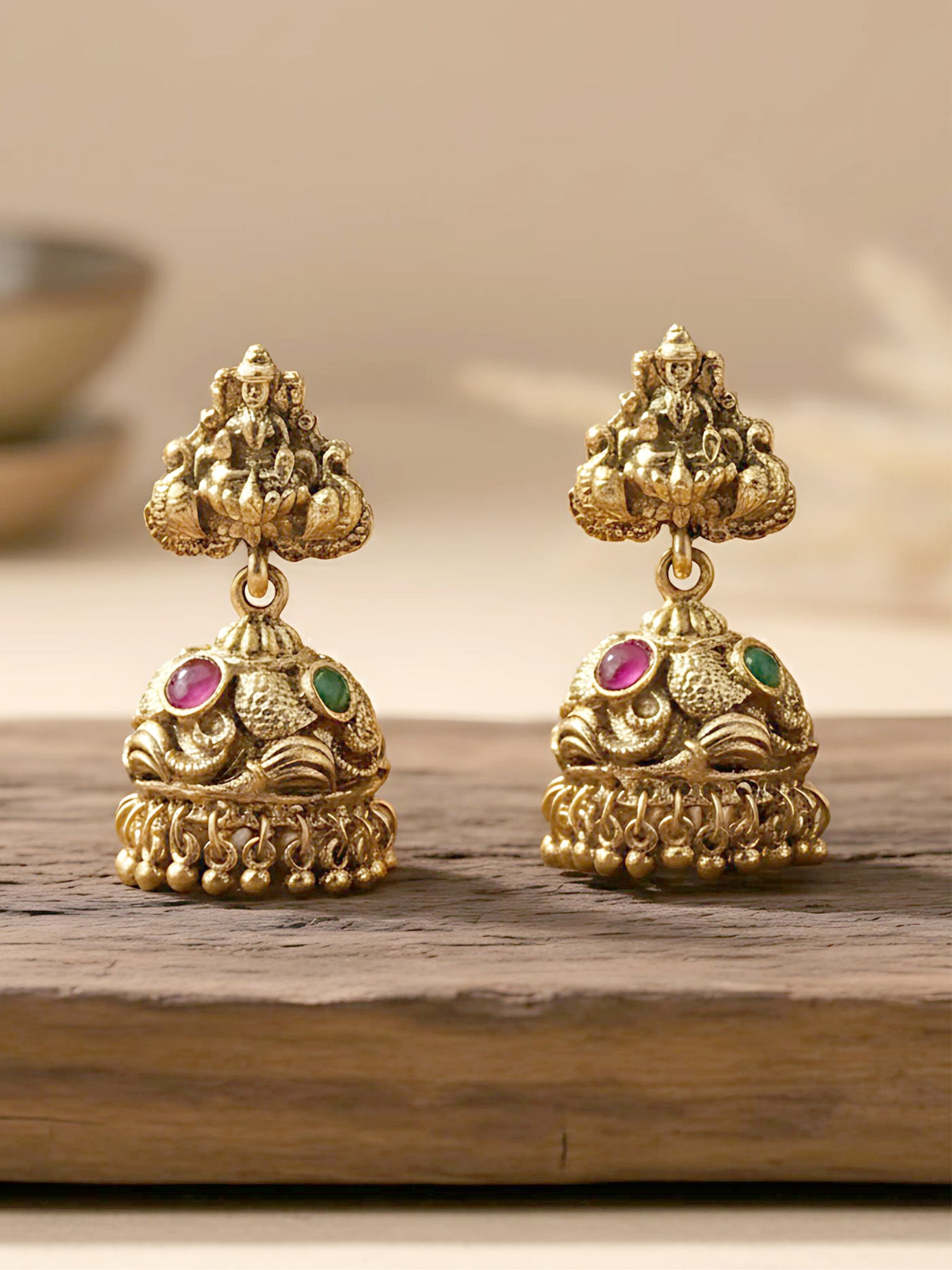 Karatcart Elegant Red and Green Stone Gold Plated Laxmi Mata Design Jhumki Earrings for Women