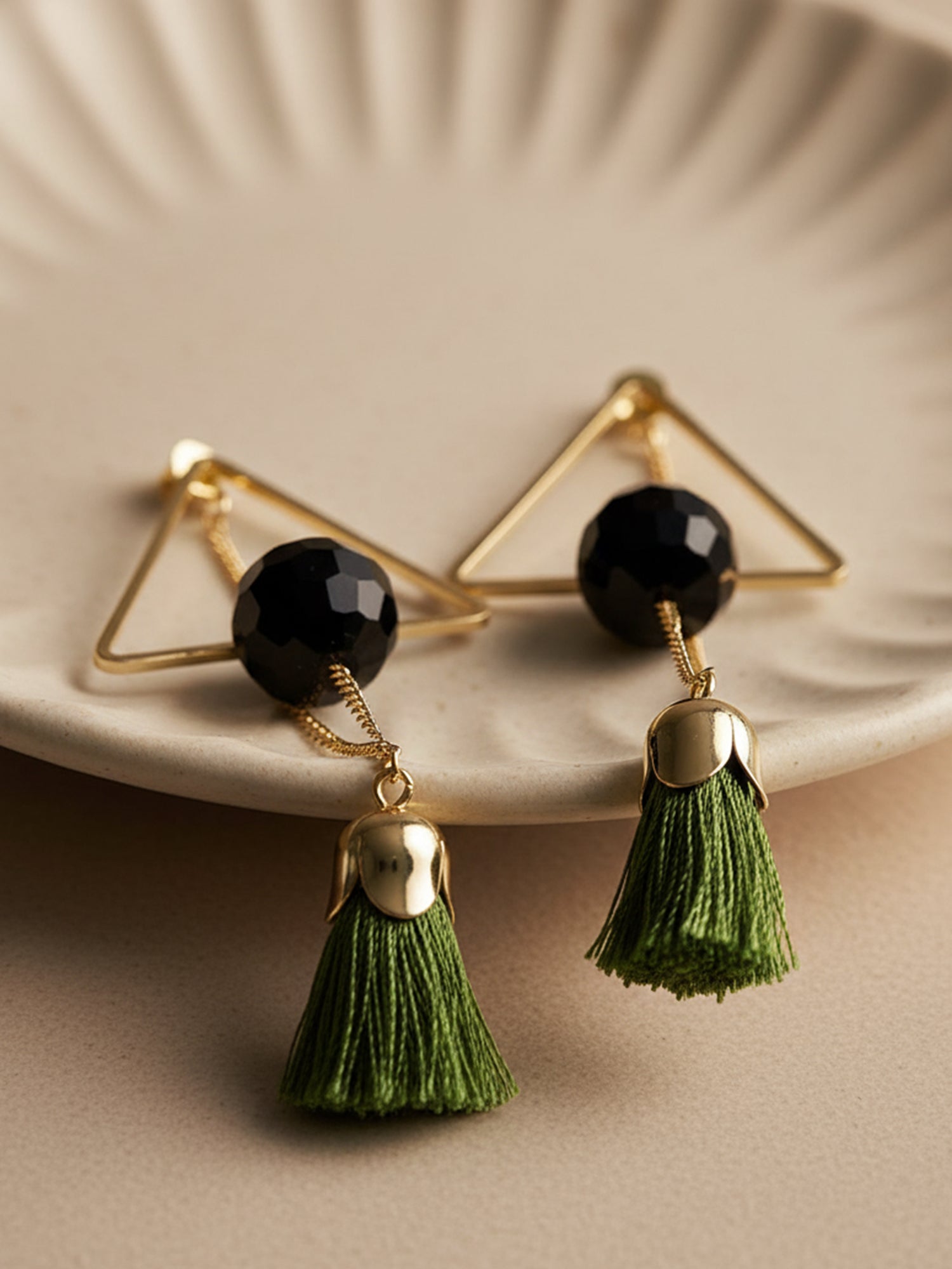 Metal Gold Geometrical Earrings adorned with green thread tassels
