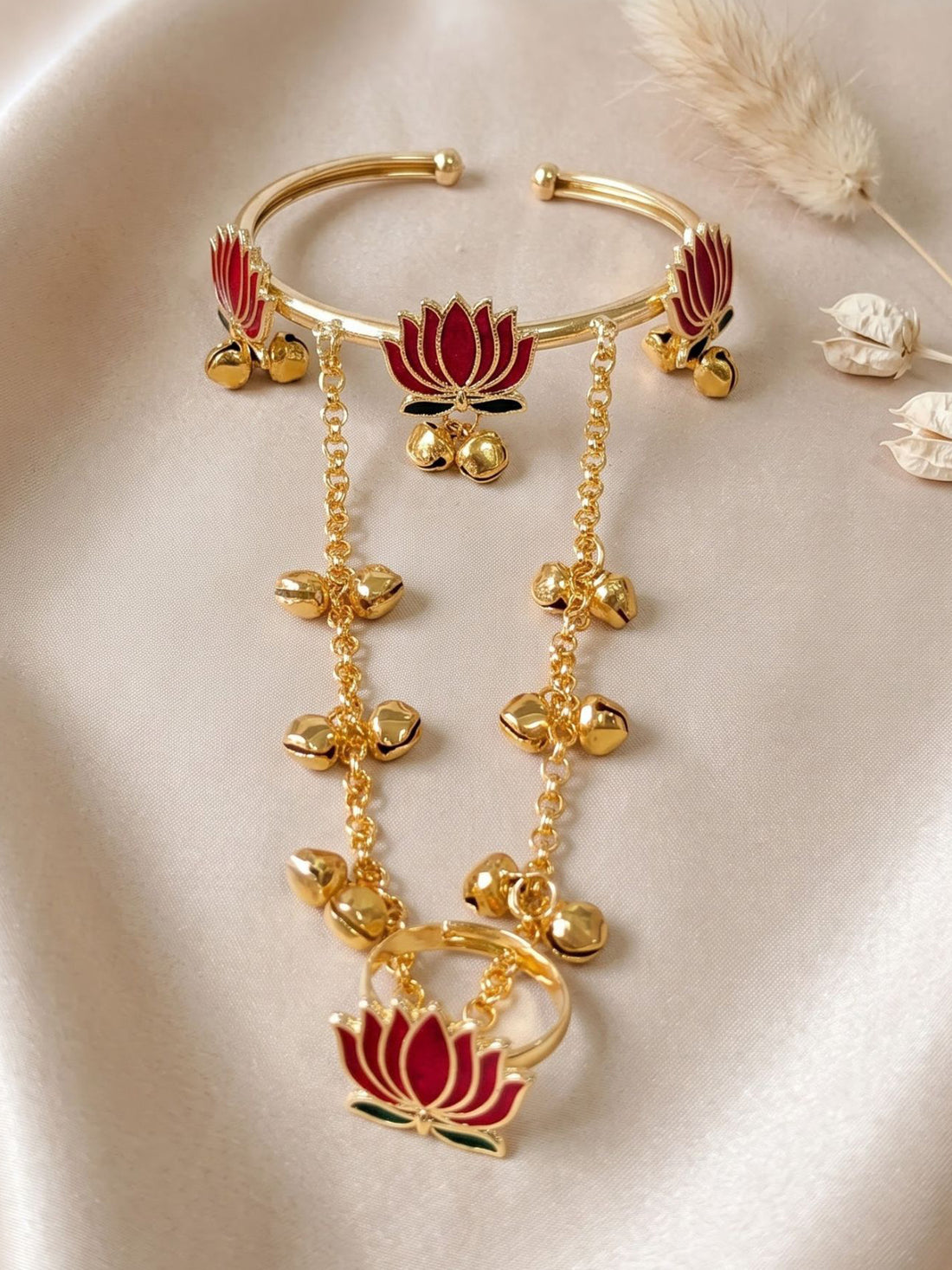 KARATCART Designer Gold Tone Red Lotus Chain Hathphool Bracelet with Bell Charms for Women
