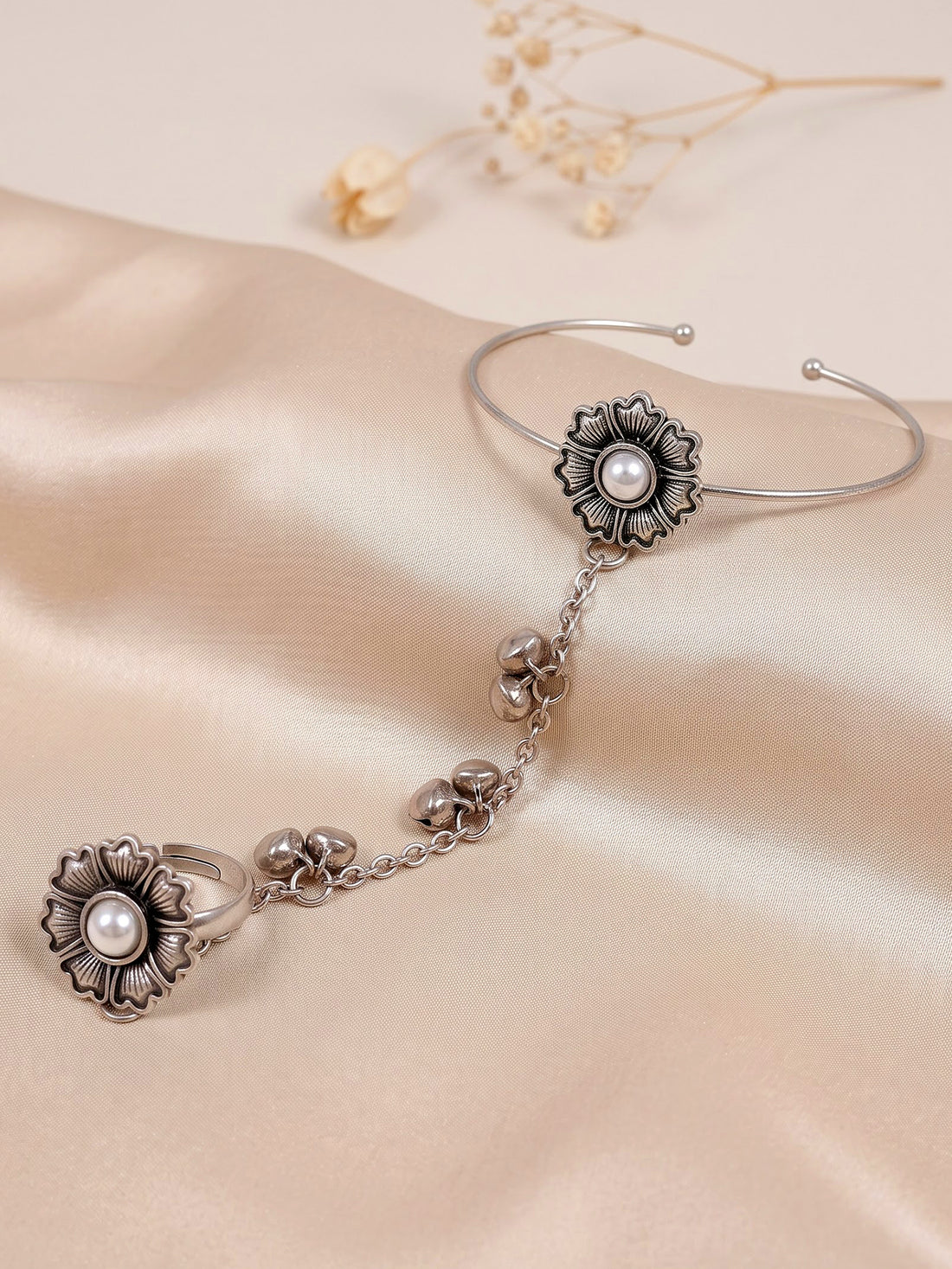 KARATCART Oxidised Silver Pearl Flower Chain Hathphool Bracelet with Bell Charms for Women