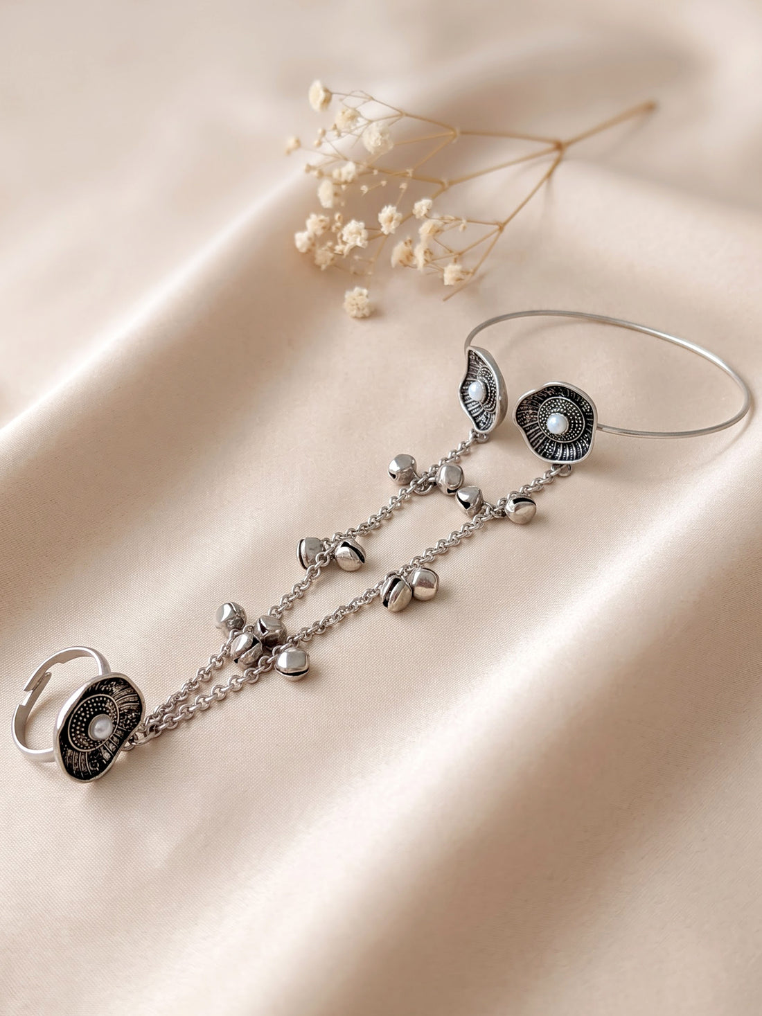 KARATCART Oxidised Silver Floral Pearl Hathphool Bracelet with Bell Charms for Women