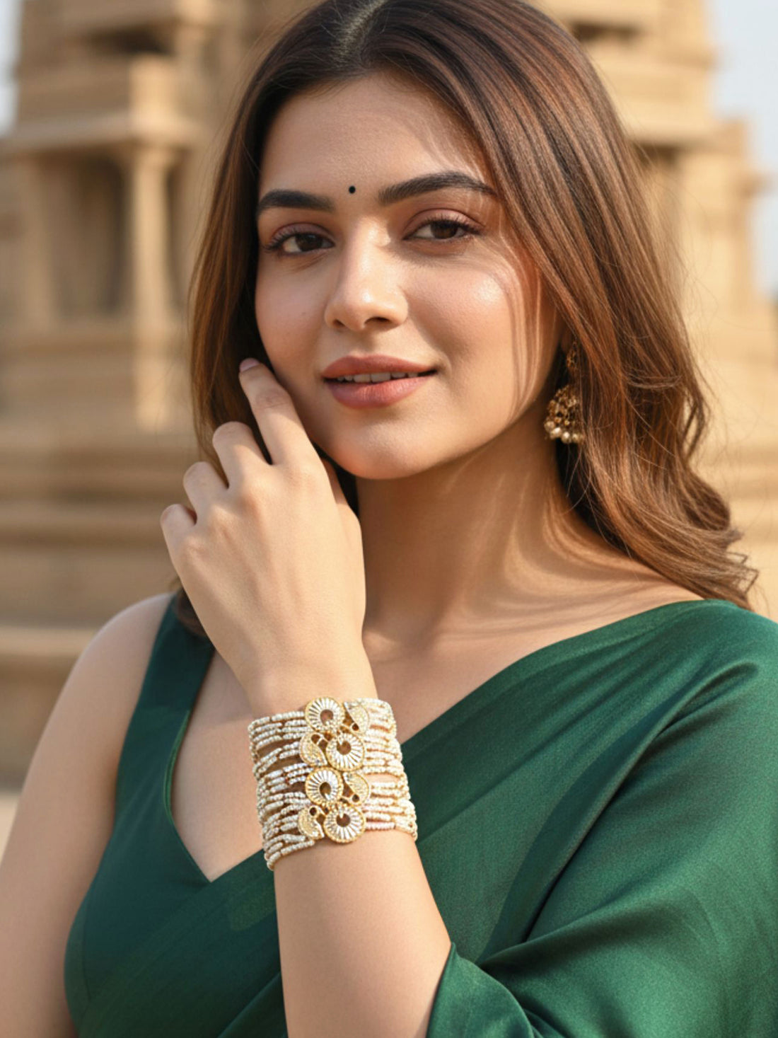 KARATCART Designer Gold-Plated Pearl Beaded Fish Motif Kundan Bracelet for Women