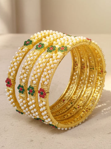 KARATCART Traditional Set of 4 Gold-Plated Pearl Studded Kundan Style Bridal Bangles for Women