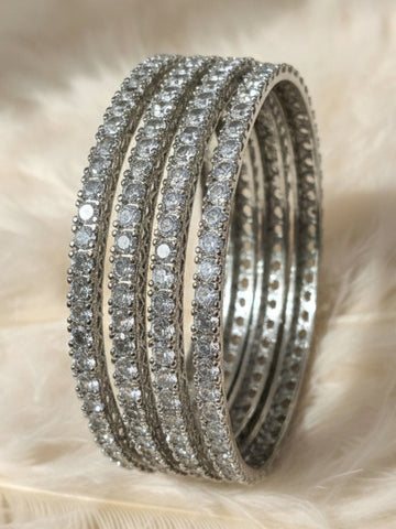 KARATCART Classic Set of 4 Silver Plated White American Diamond Bangles for Women