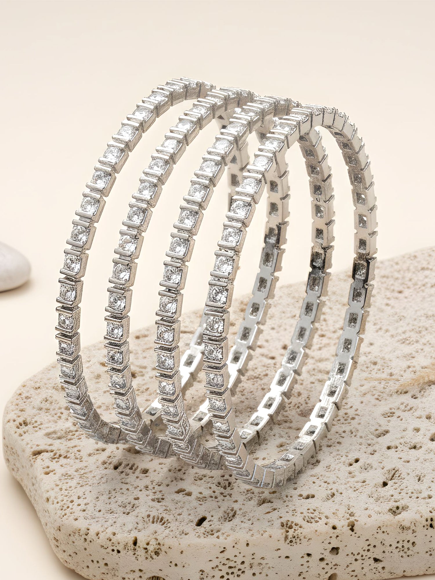 Karatcart Silver Plated Set of 4 Round American Diamond Studded Bangles for Women