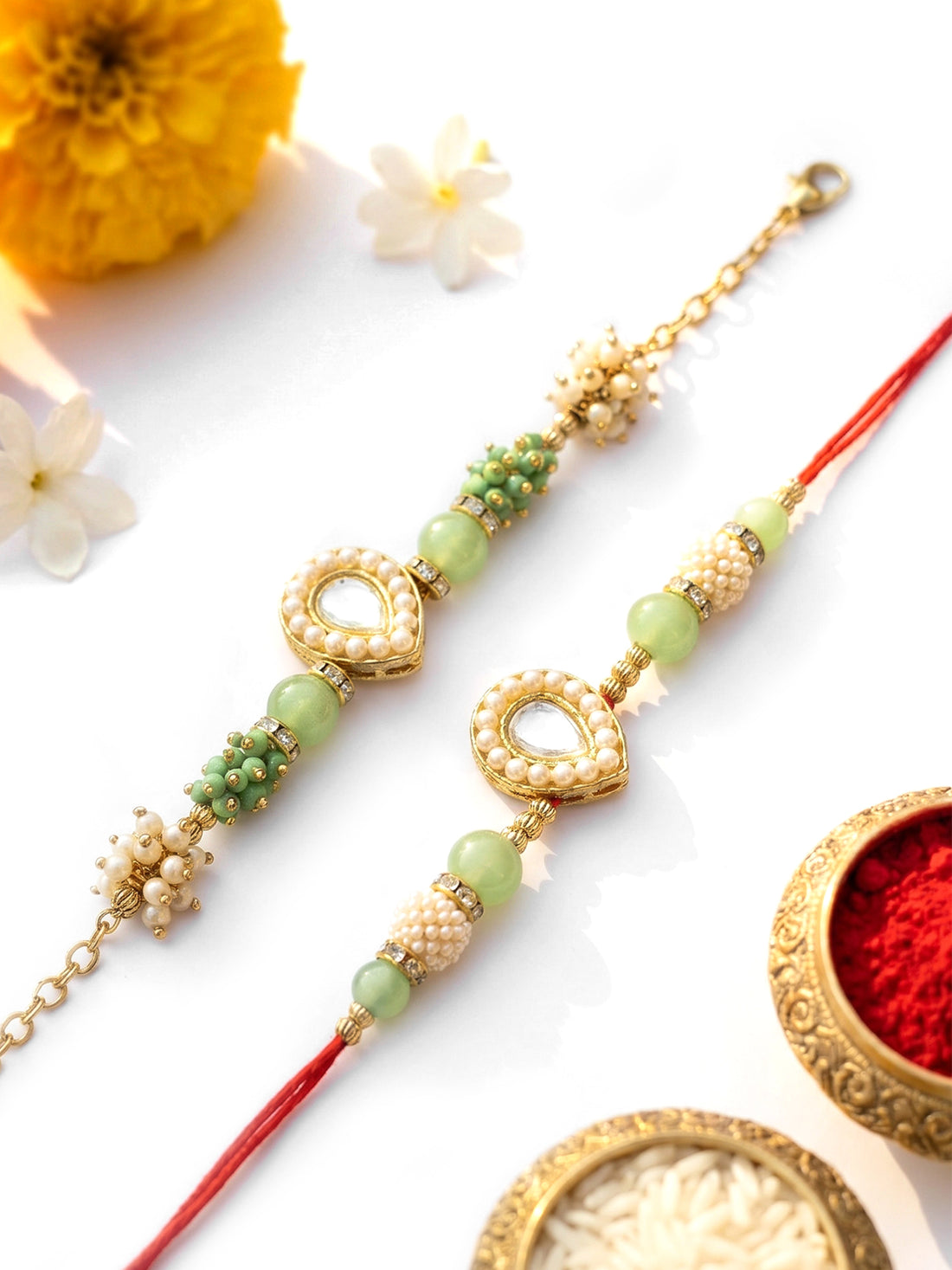 KARATCART Set of 2 Gold Plated Light Green Crystal Kundan Bhaiya Bhabhi Rakhi Combo with Roli & Chawal