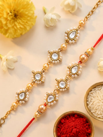 KARATCART Set of 2 Gold Plated Golden Pearl Handmade Kundan Bhaiya Bhabhi Rakhi Combo with Roli & Chawal