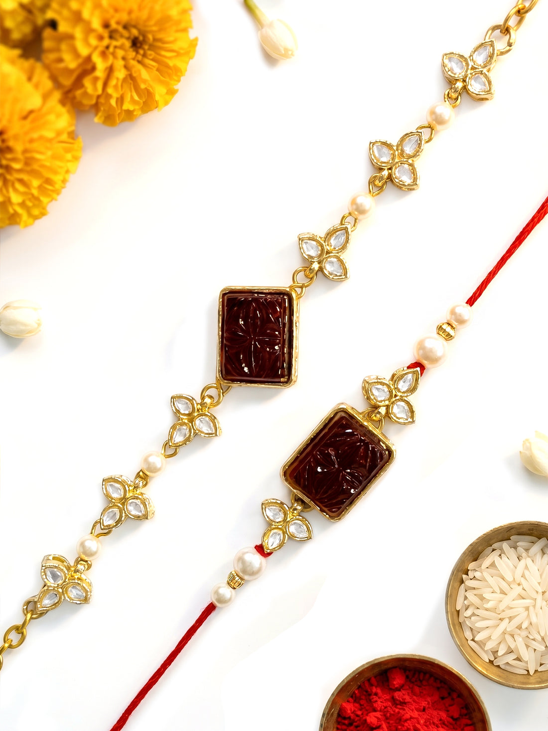 KARATCART Set of 2 Gold Plated Red Carved Stone Kundan Handmade Bhaiya Bhabhi Rakhi Combo with Roli & Chawal
