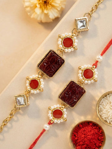 KARATCART Set of 2 Gold Plated Red Carved Stone Kundan Bhaiya Bhabhi Rakhi Combo with Roli & Chawal