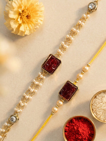 KARATCART Set of 2 Gold Plated Red Carved Stone and Pearl Kundan Bhaiya Bhabhi Rakhi Combo with Roli & Chawal