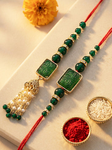 KARATCART Set of 2 Gold Plated Green Carved Stone Kundan Handmade Bhaiya Bhabhi Rakhi Combo with Roli & Chawal