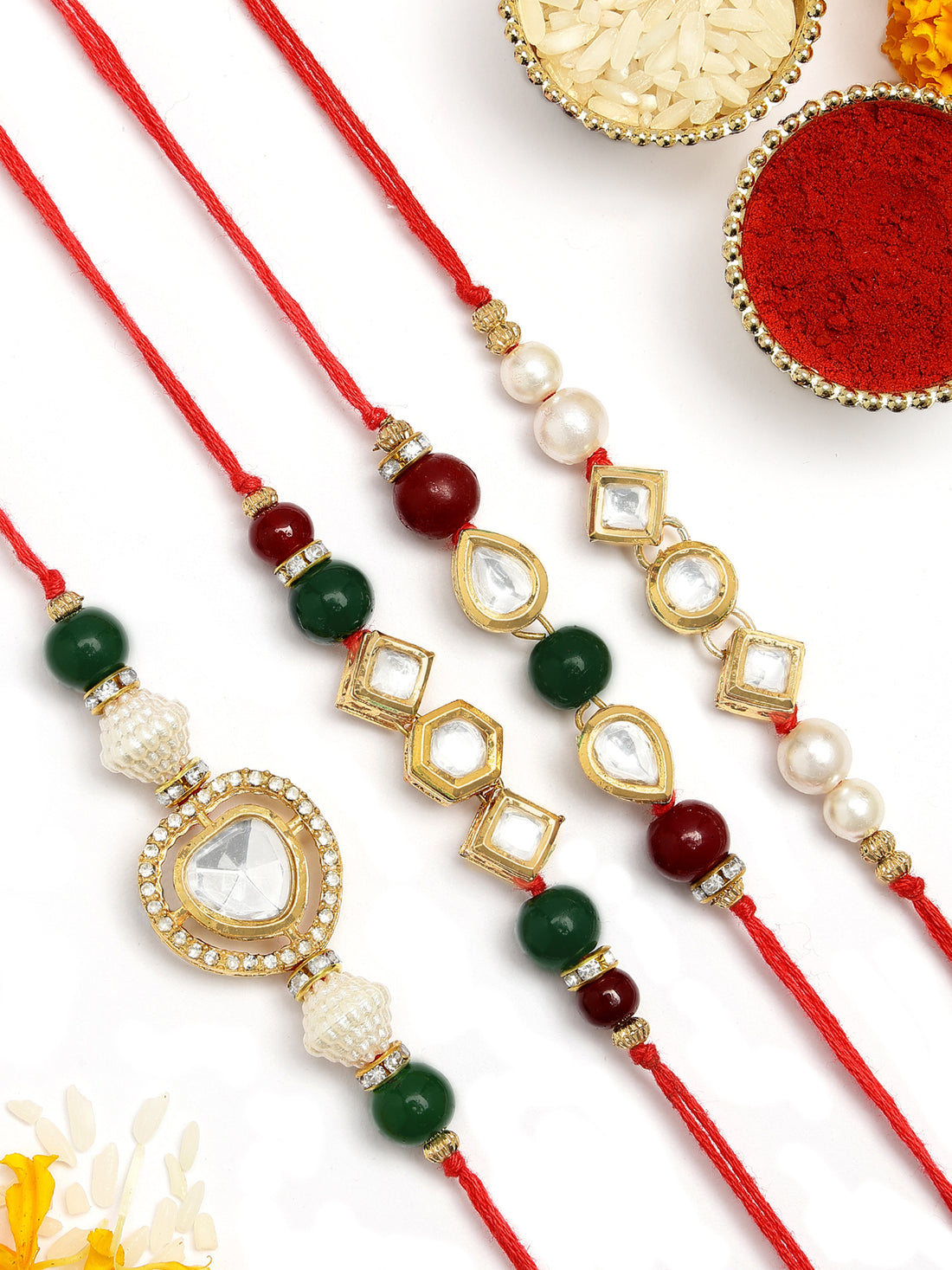 KARATCART Set of 4 Gold Plated Handmade Kundan Rakhi Combo with Roli & Chawal
