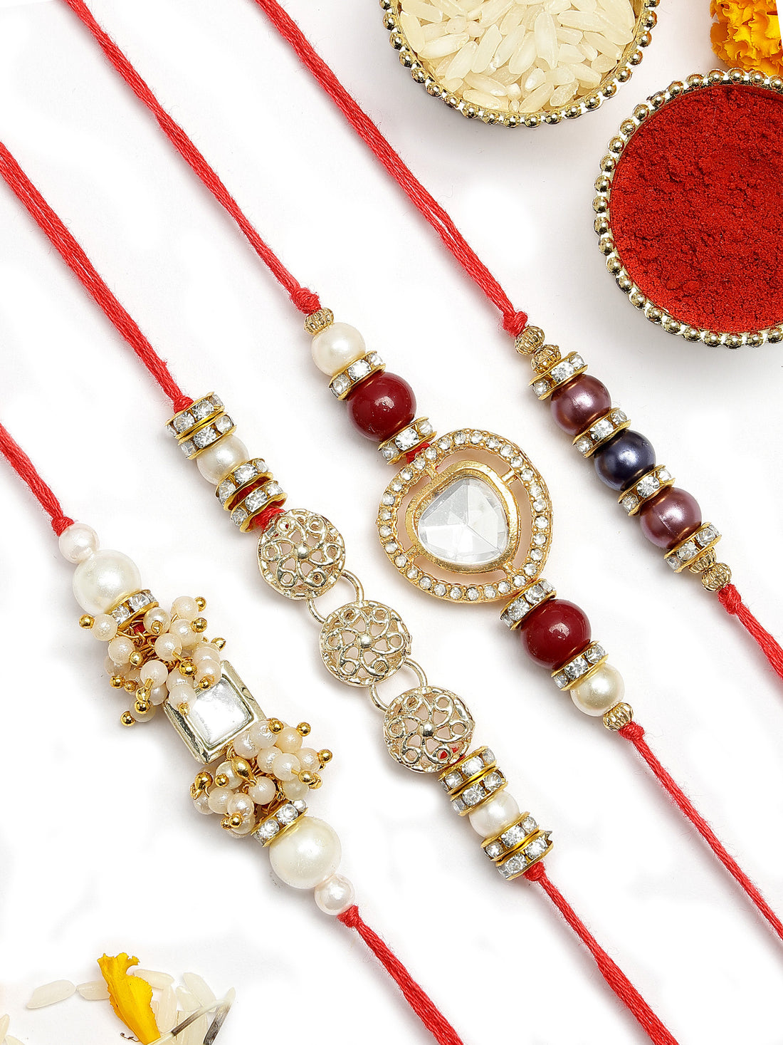 KARATCART Set of 4 Gold Plated Handmade Kundan Rakhi Combo with Roli & Chawal