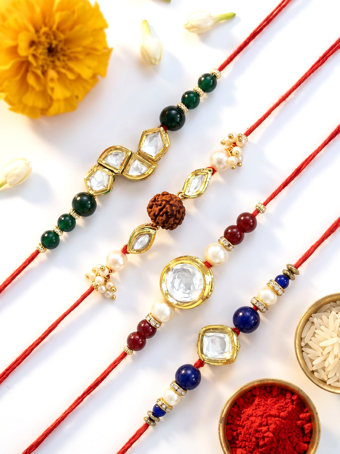 KARATCART Set of 4 Gold Plated Handmade Kundan Rakhi Combo with Roli & Chawal