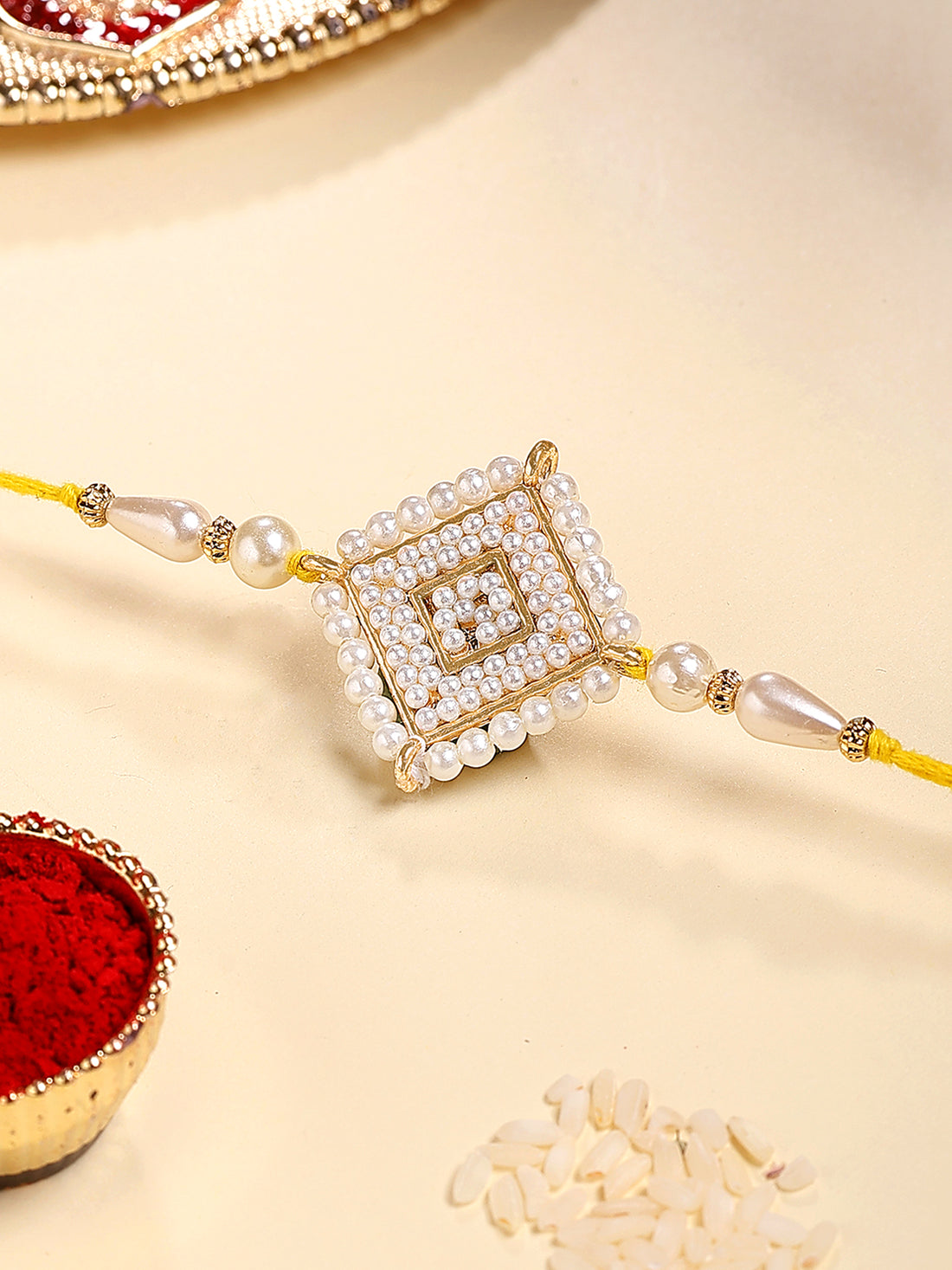 Karatcart Gold Plated White Pearl Studded Floral Kundan Bhiya Rakhi with Roli & Chawal