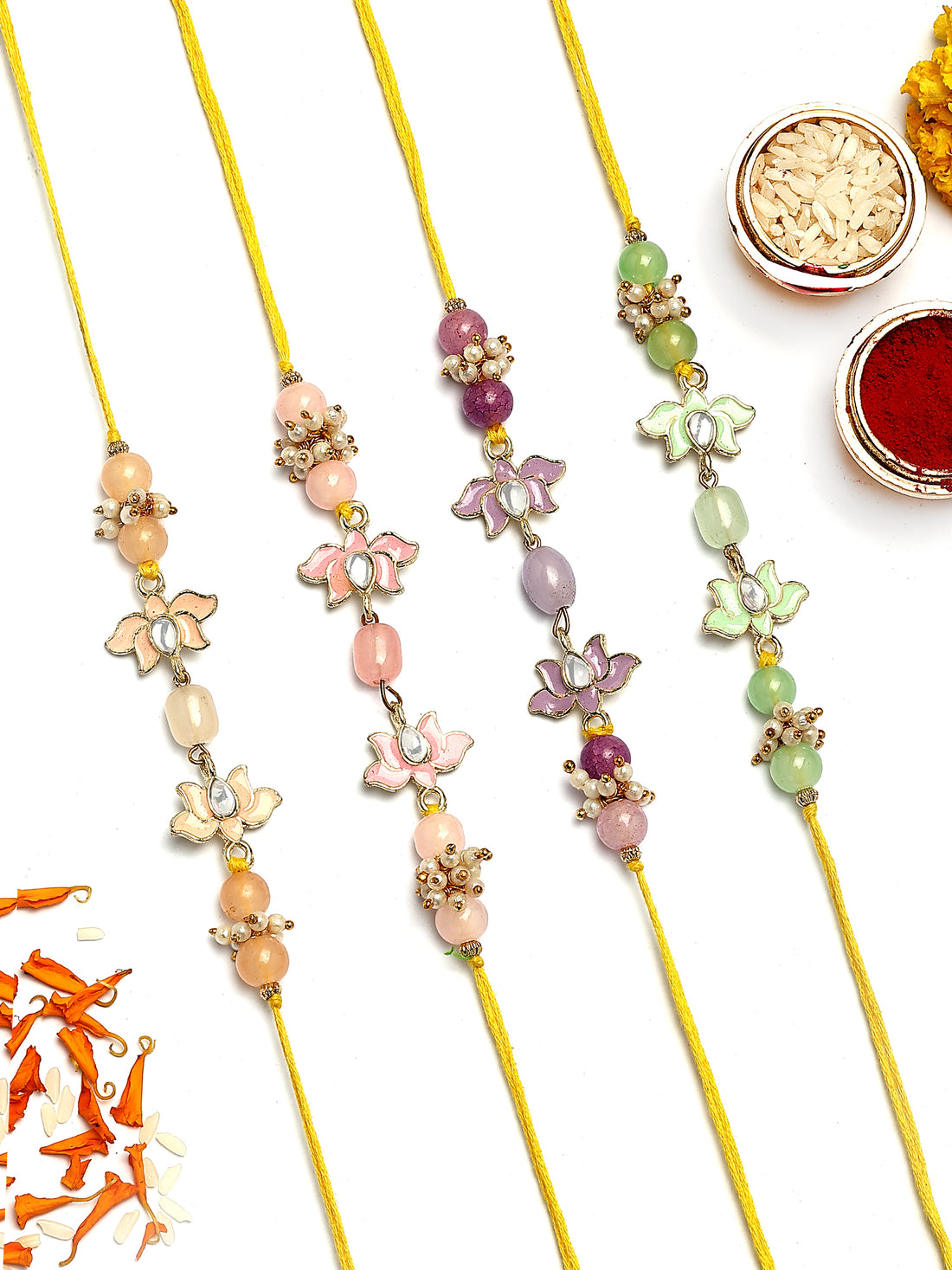 KARATCART Set of 4 Pastel Lotus Enamel Design Kundan Rakhi for Brother with Roli & Chawal