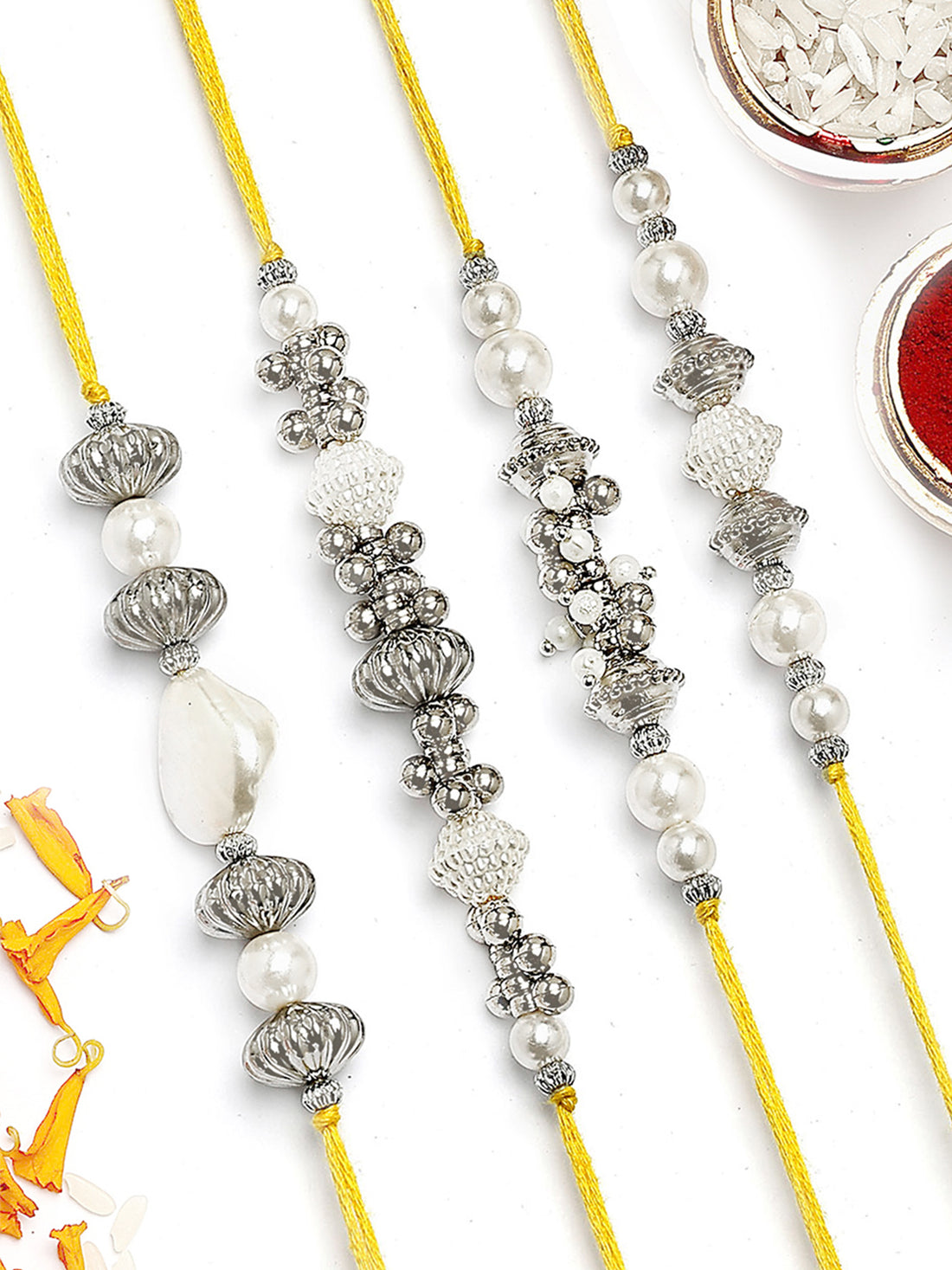 KARATCART Set of 4 Silver Beads and Pearl Kundan Rakhi for Brother with Roli & Chawal