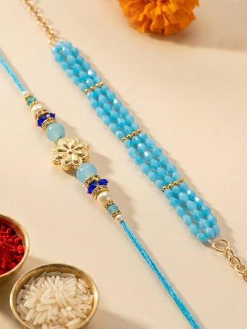 KARATCART Gold Plated Blue Crystal Floral Bhaiya Bhabhi Rakhi with Roli & Chawal
