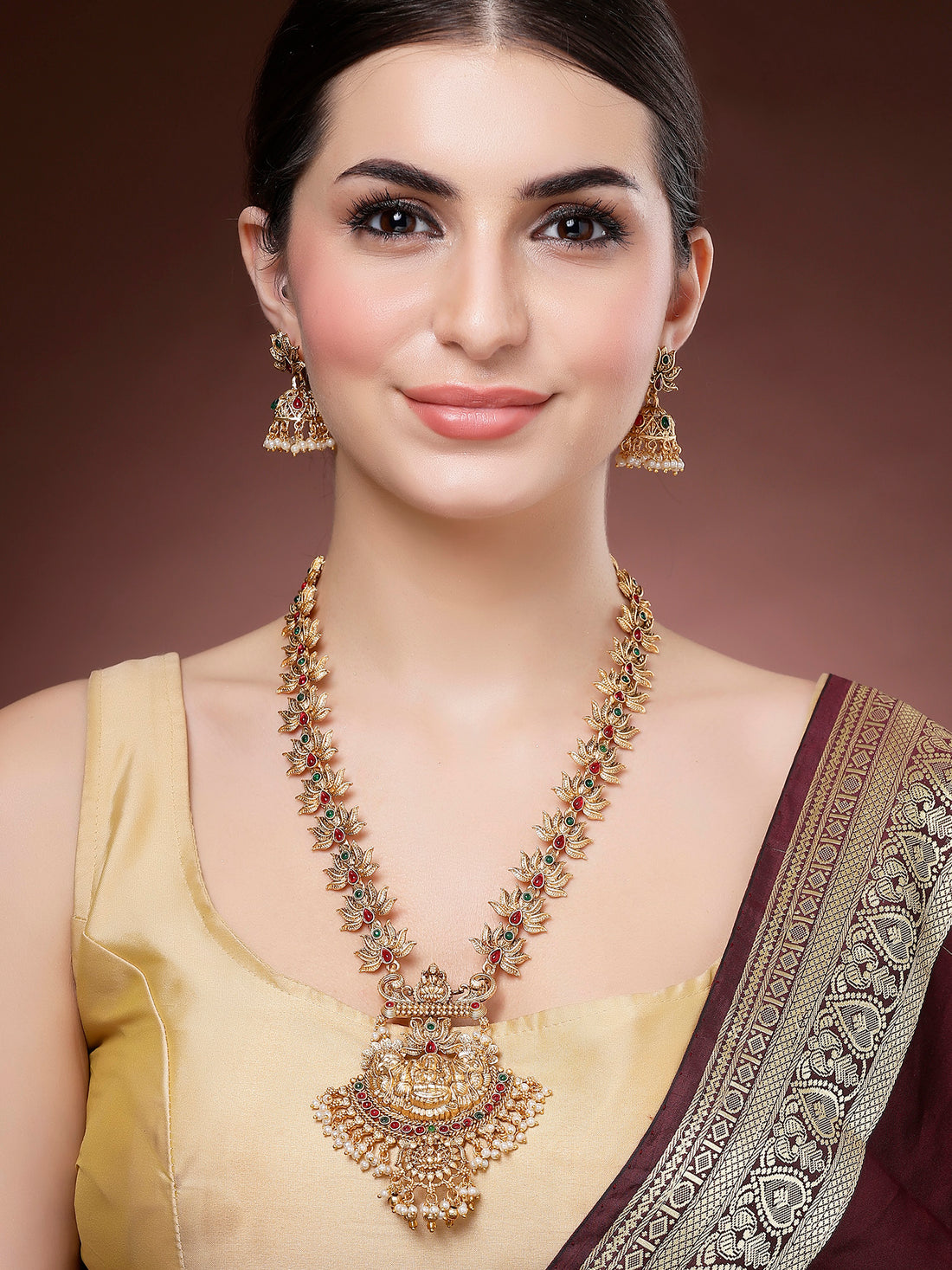 Karatcart Gold Plated Laxmi Mata Engraved Lotus Design Long Temple Jewellery Set for Women