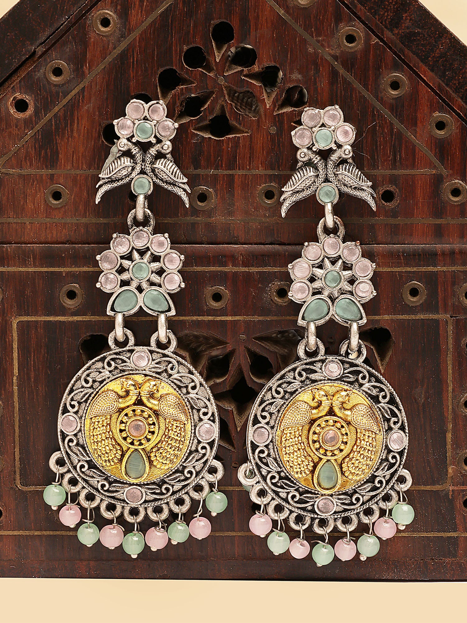 Karatcart Dual-Toned Oxidized Designer Earrings with Peacock Motif, Pastel Stones Danglers for Women