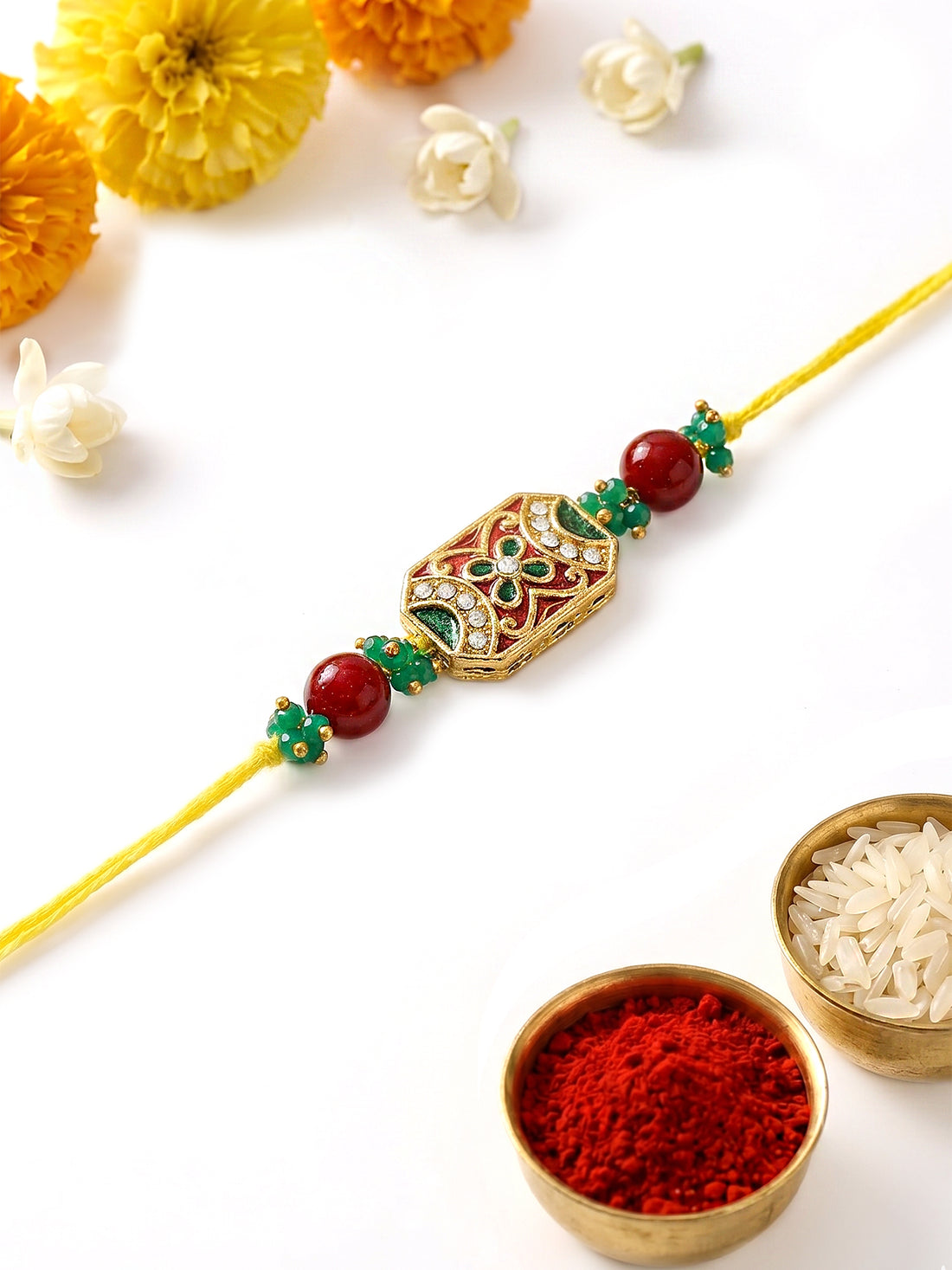 KARATCART Classic Red and Green Meena Crystal Studded Handmade Rakhi for Brother with Roli & Chawal