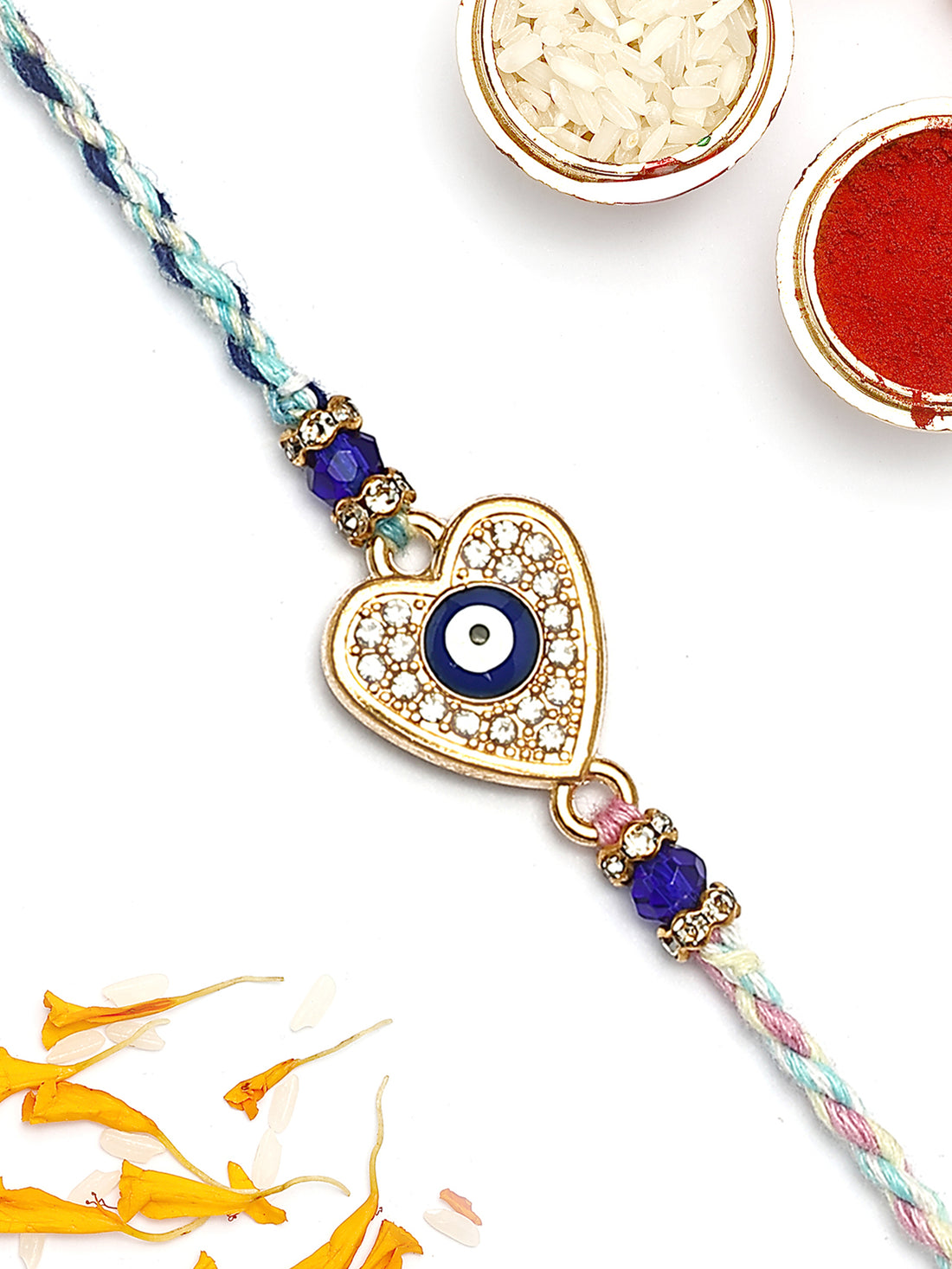 KARATCART Gold Plated Blue American Diamond Heart Shape Evil Eye Bhaiya Rakhi with Roli & Chawal