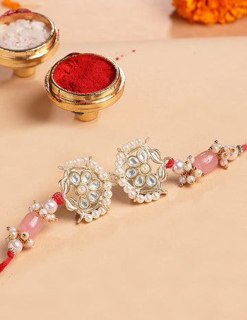 KARATCART Gold Plated Pink Tumble Kundan Bhaiya Rakhi with Roli & Chawal