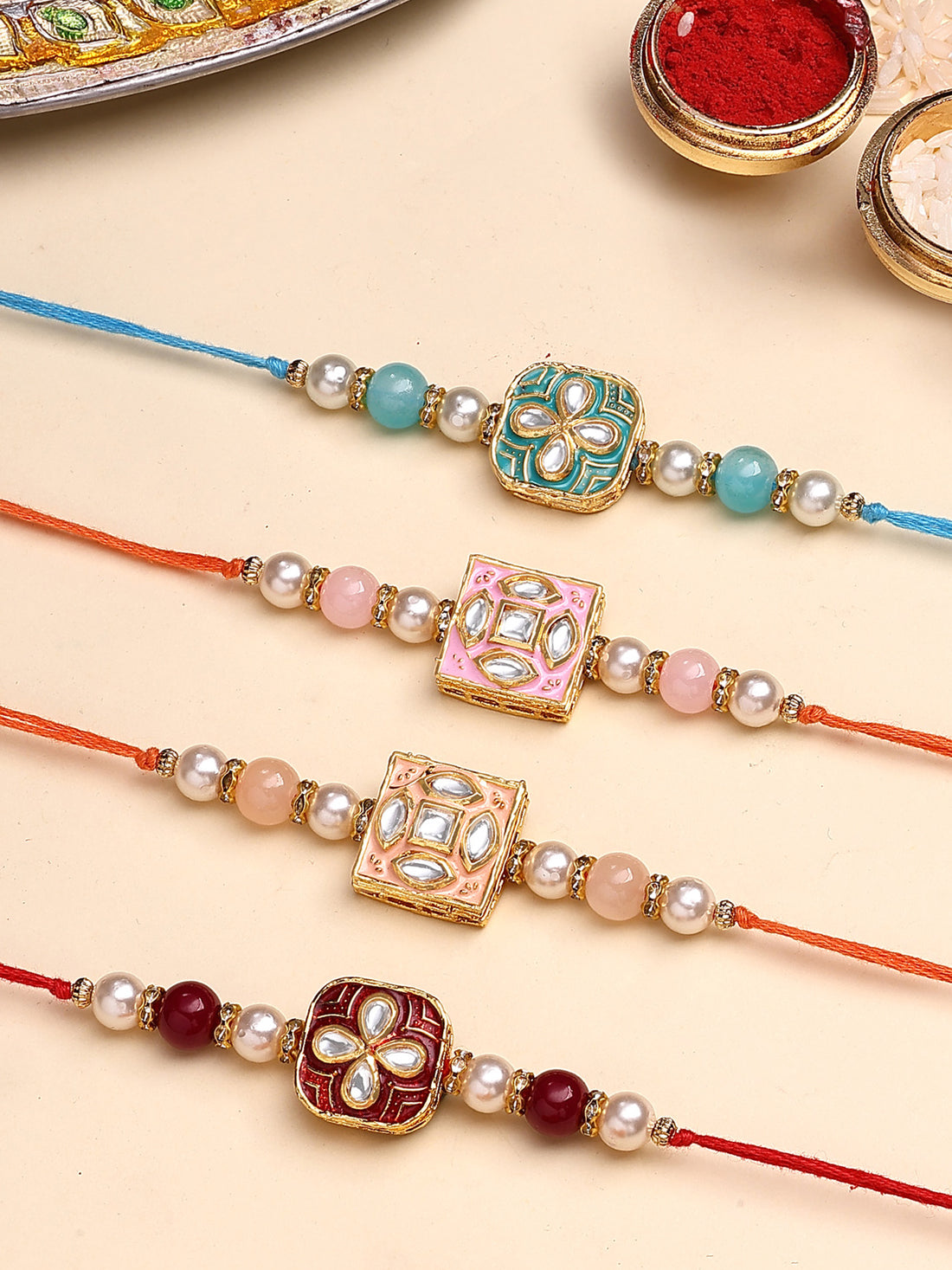 Karatcart Set of 4 Sqaure Floral Design Enamel Kundan Rakhi for Brother with Roli & Chawal