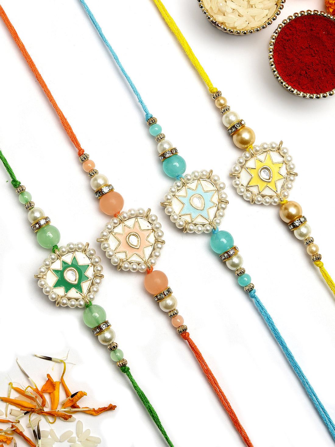 KARATCART Set of 4 Handmade Meenakari Heart Shape Kundan Rakhis for Brother with Roli & Chawal