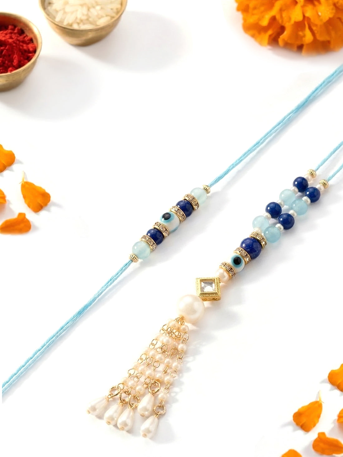 KARATCART Gold Plated Evil Eye Blue Beads and Pearl Kundan Bhaiya Bhabhi Rakhi with Roli & Chawal
