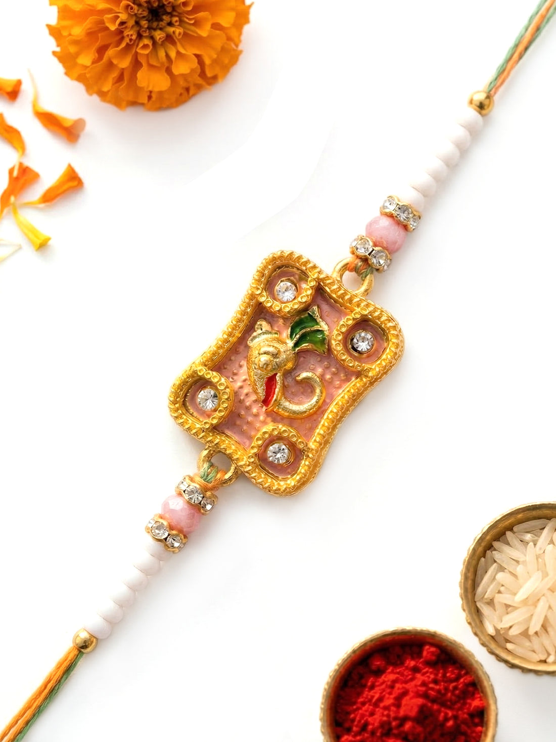 KARATCART Gold Plated Pink Meena Ganesha Kundan Bhaiya Rakhi with Roli & Chawal