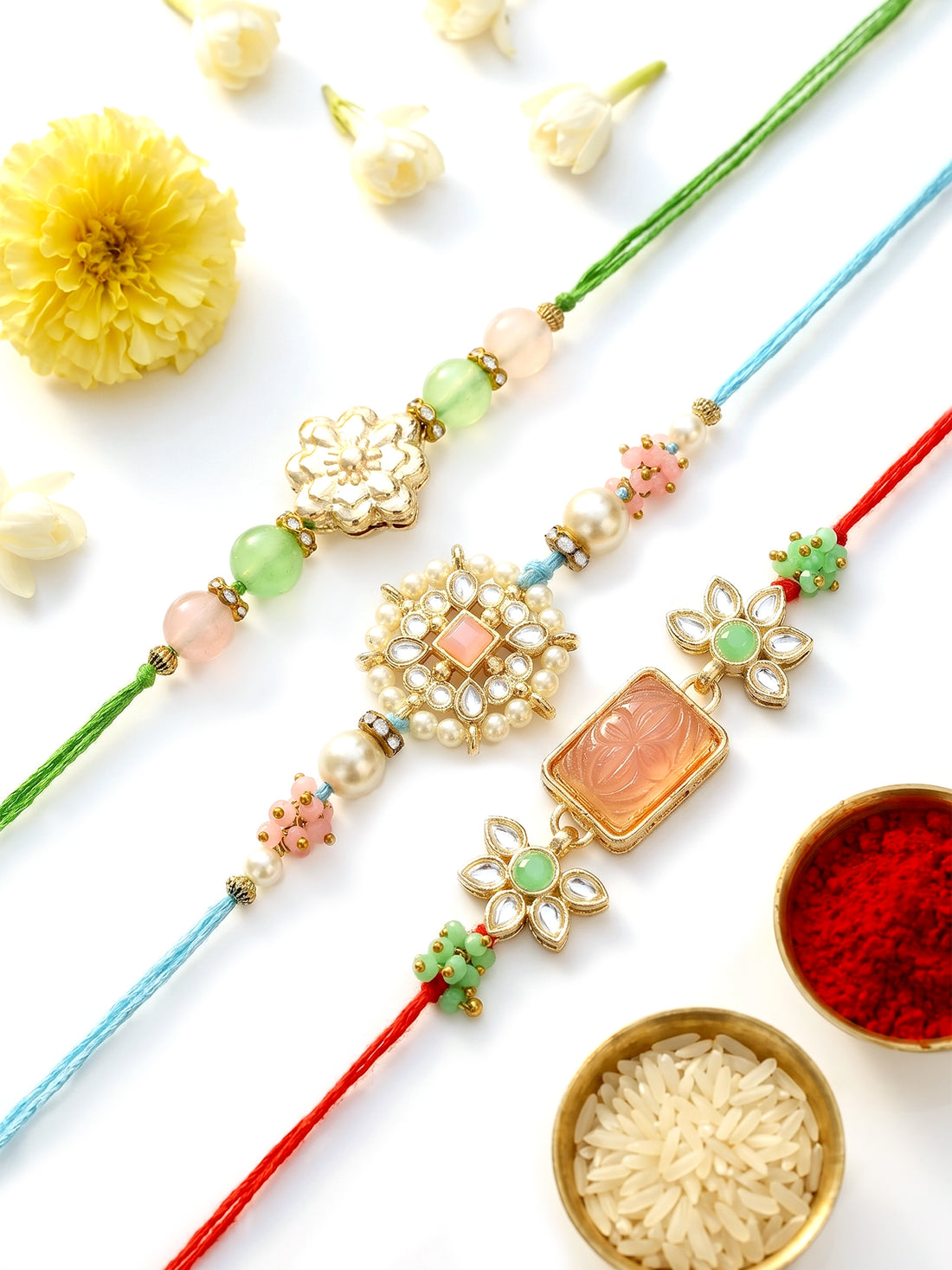 KARATCART Set of 3 Handmade Pink Carved Stone Floral Kundan Rakhis for Brother with Roli & Chawal