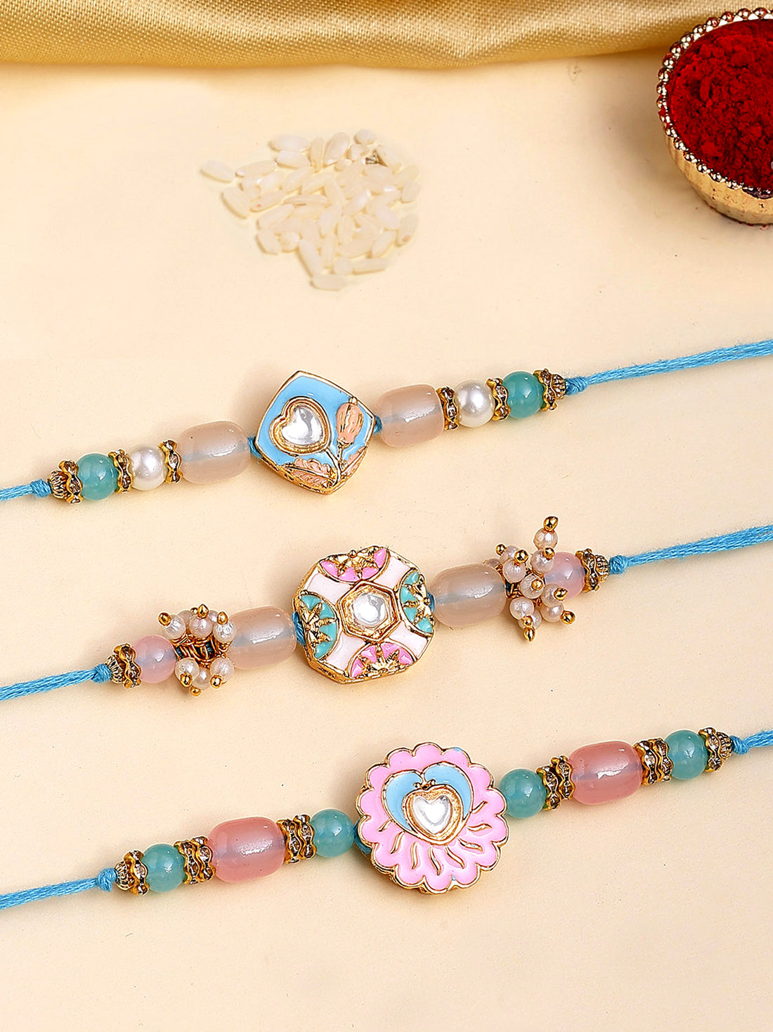 Karatcart Set of 3 Pink and Blue Enamel Kundan Rakhi for Brother with Roli & Chawal