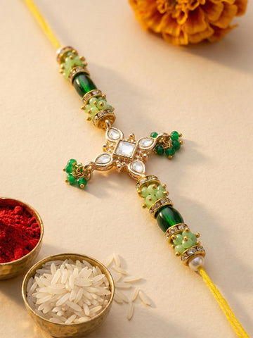 KARATCART Gold Plated Green Crystal Floral Kundan Bhaiya Rakhi with Roli & Chawal